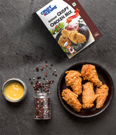 Crust & Crumb Instant Crispy Chicken Mix - pepper & spicy packaging with fried chicken wings on a dark surface.